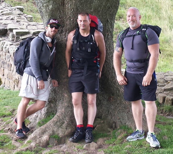 Ben Junior, Lee and Ben Senior gathered at the base of the tree